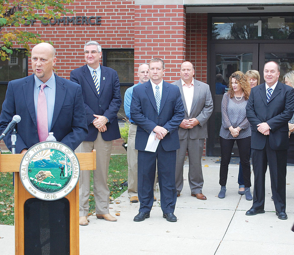 Mike McCarty '90 (left) and Crawfordsville Mayor Todd Barton '00 (far right) and press announcement on November 3)
