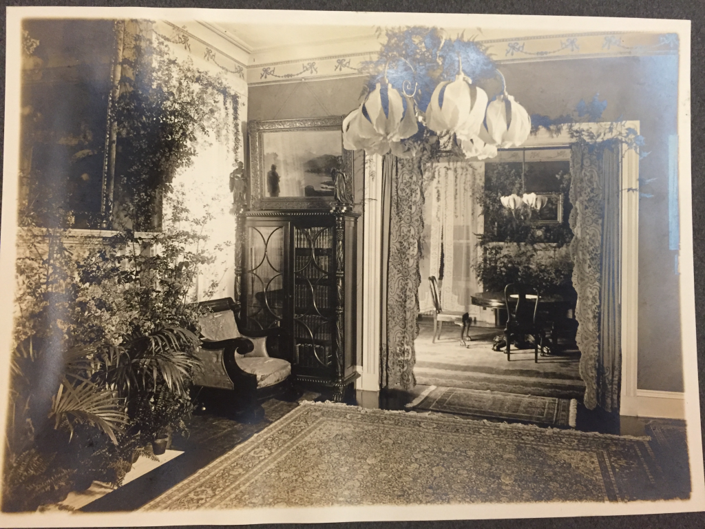 An Image of this painting hanging over a cabinet in the Mills House in the 1800s. The home is decorated with plants and flowers for a wedding. Photographic scrapbook "The Old Homestead", Robert T. Ramsey Jr. Archival Center, Wabash College, Crawfordsville, IN, file DC1022j.