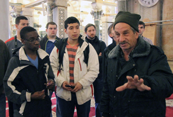 Tour guide assures students he knows "all the answers."