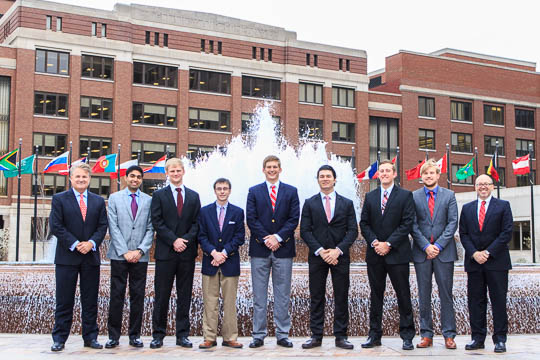 David Lewis '81 and President Hess flank the seven Wabash men who ill join Eli Lilly 