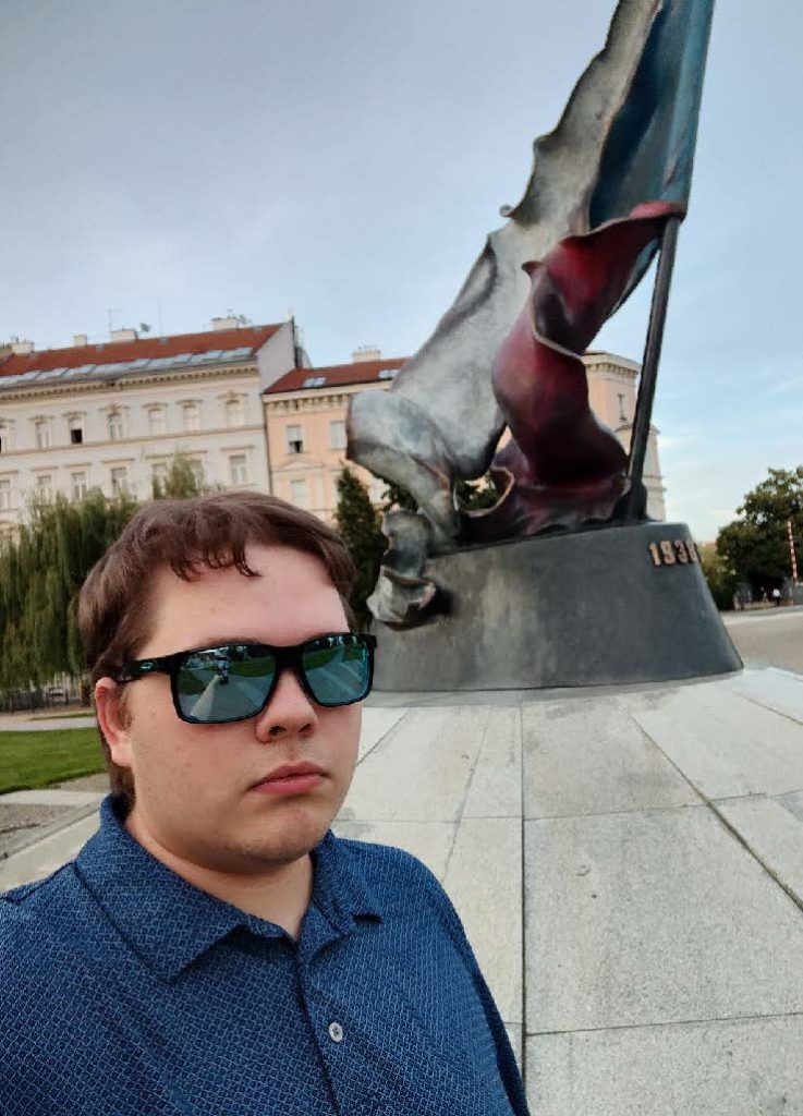 Benjamin Weaver ’26 next to the Memorial of the Second Resistance Movement, dedicated to resisting the Nazi occupation of Czechoslovakia.